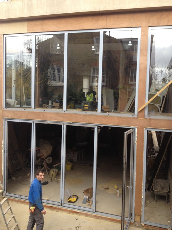 Aluminium bi-fold doors with two-storey glazing in Bellingham