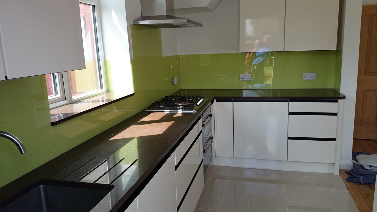 Lime green glass kitchen splashback installed by Bellingham glaziers