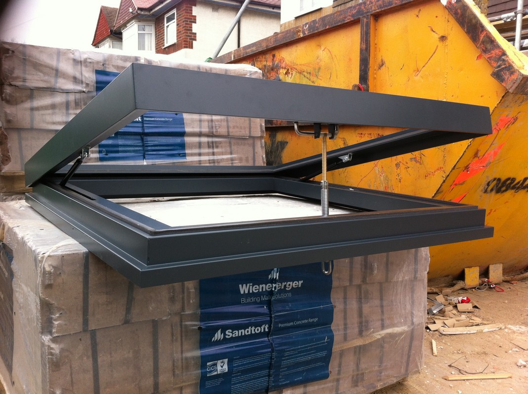Opening flat roof skylight in anthracite grey installed in Bellingham