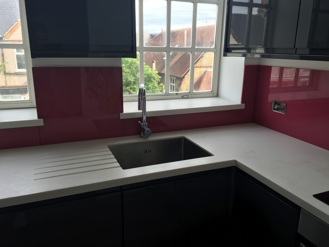 Deep plum coloured glass splashback in modern Bellingham kitchen